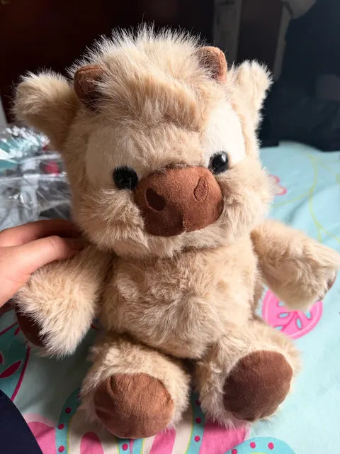 Peluche vache Highland reçue par Laura M.